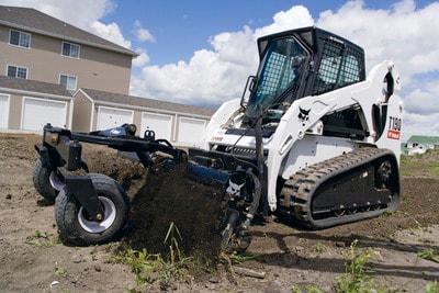 Bobcat soil conditioner preparing ground for seeding