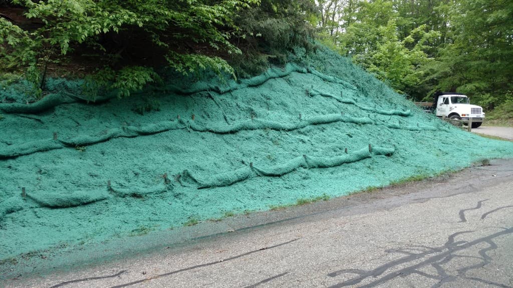 Hydromulching applied to a steep roadside slope for erosion control