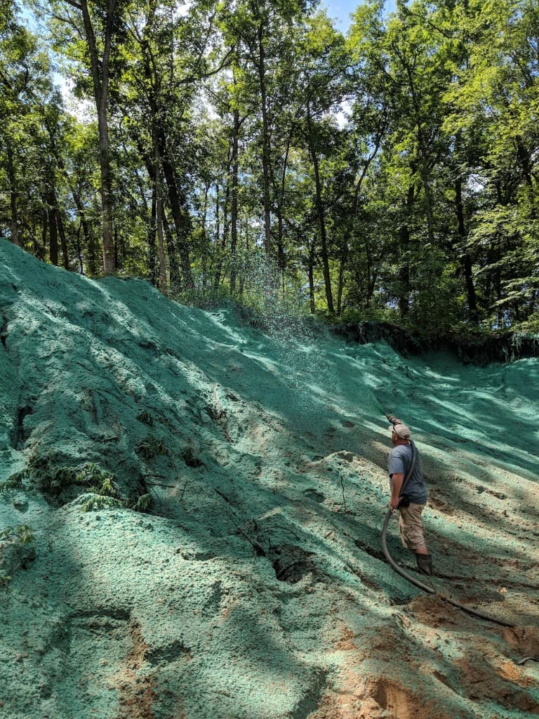 Hydromulching a steep slope for erosion control in West Michigan