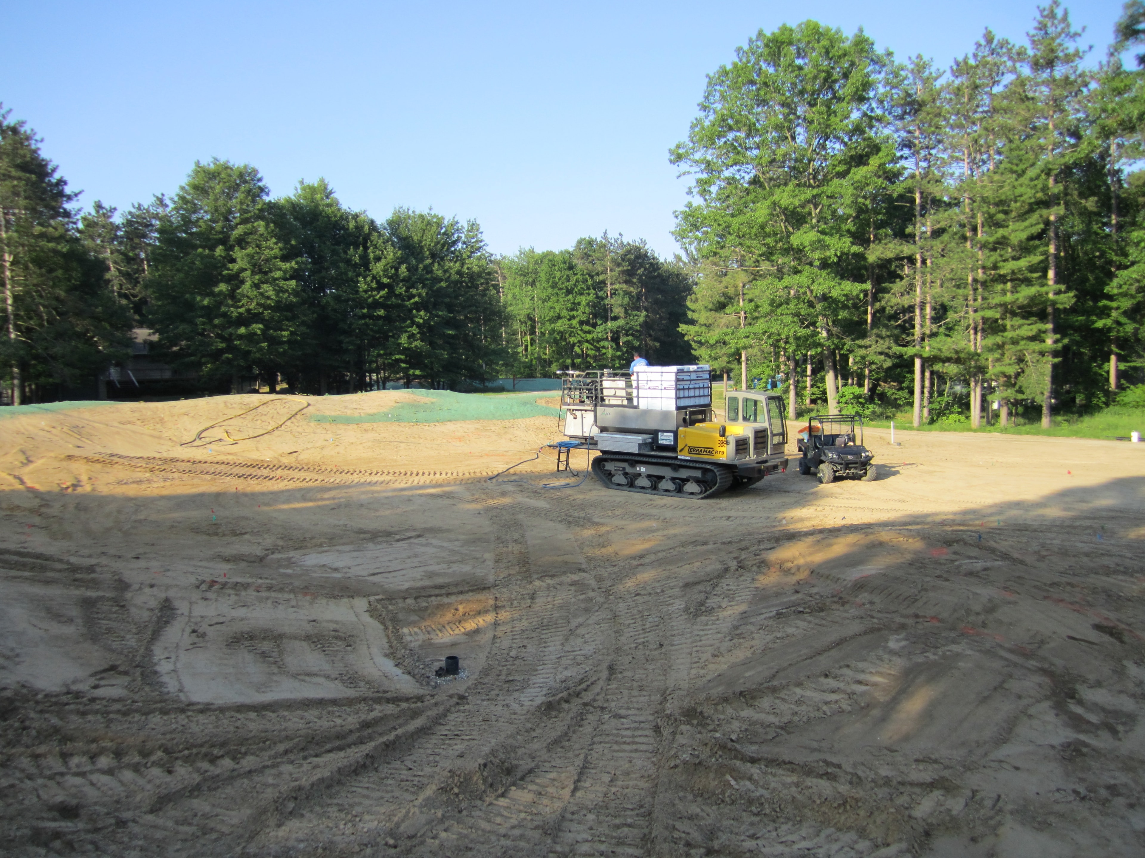 Tracked hydroseeding equipment on a bunker site at American Dunes golf course