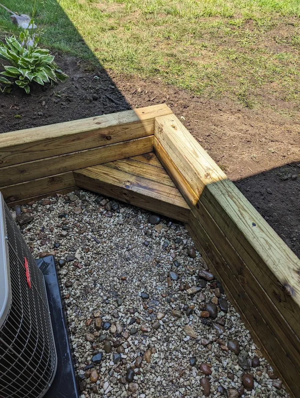 Completed timber retaining wall installation