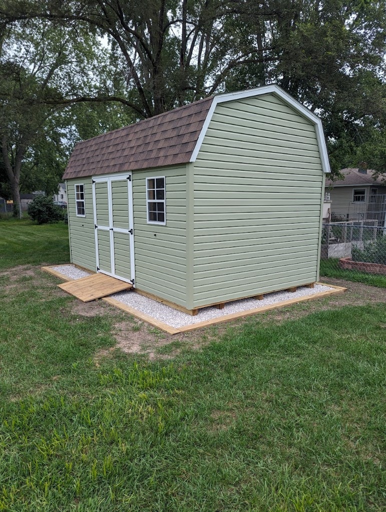 Shed on gravel pad with timber border retaining the shed base