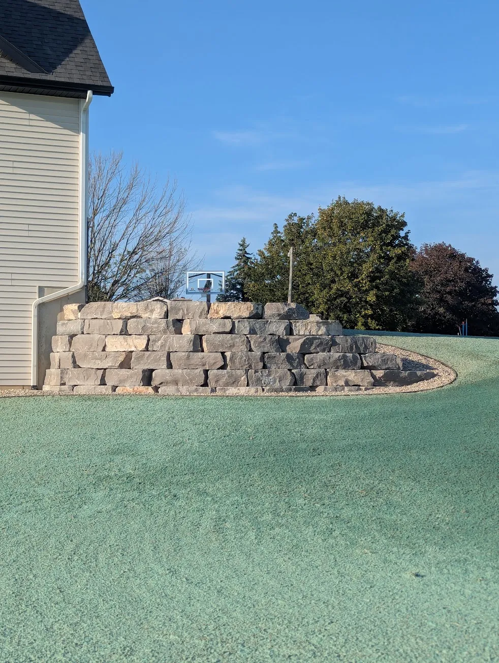 Retaining wall with hydroseeded lawn