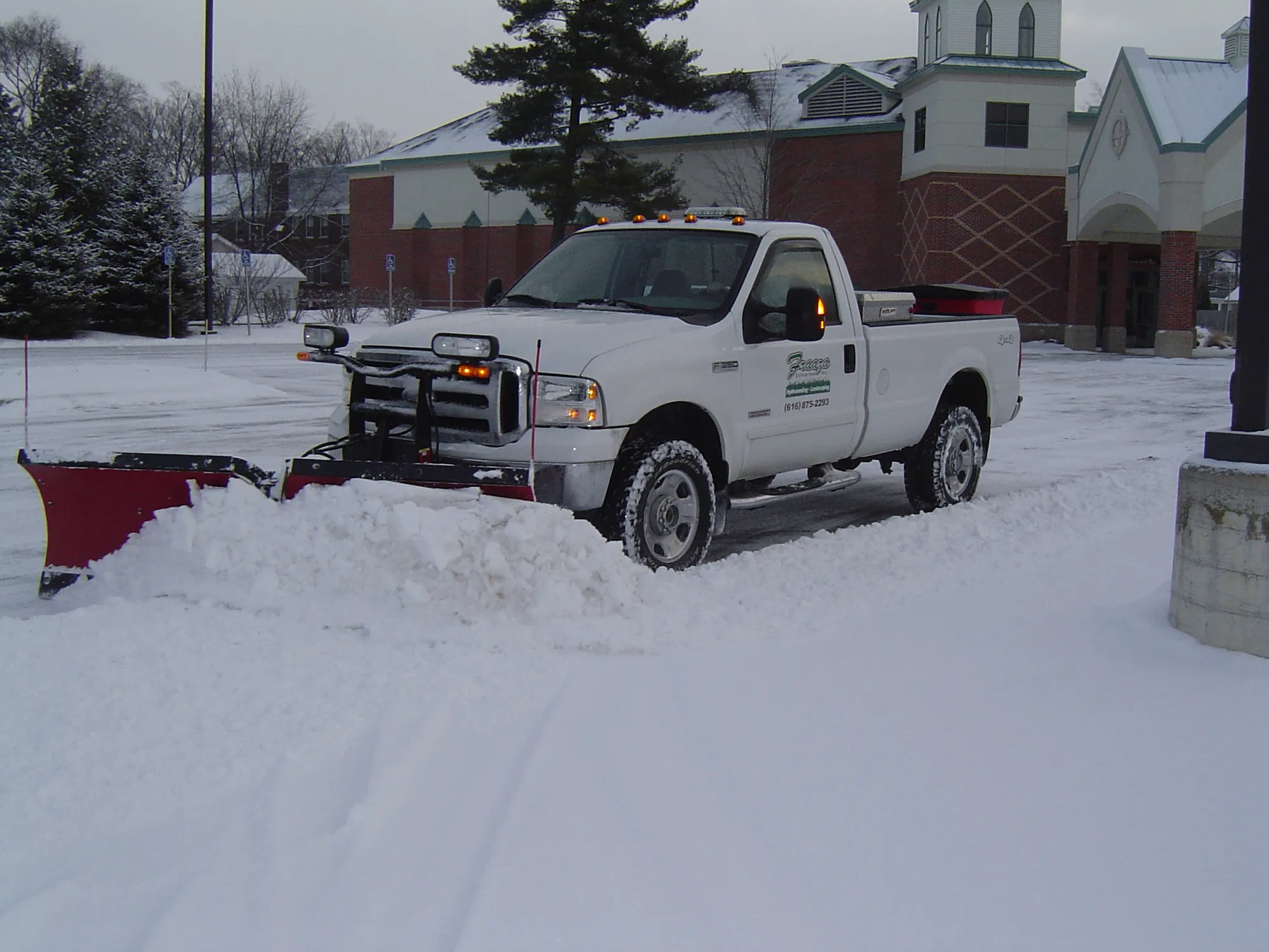Snow plow truck in action